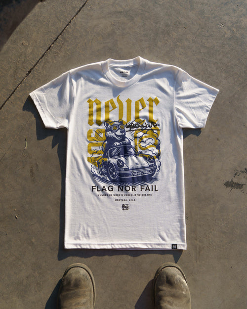 White t-shirt with graphic design on a concrete surface